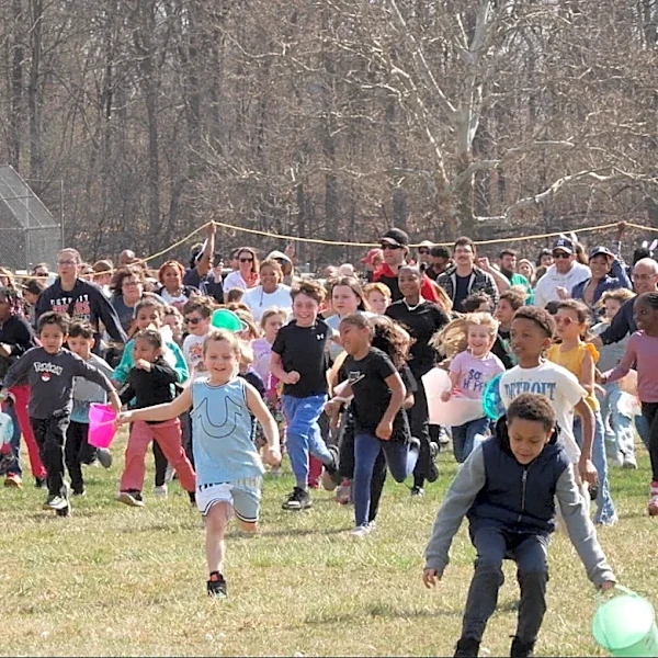 Children race to gather marshmallows dropped from a helicopter at pair of Michigan parks