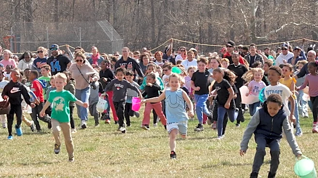 Children race to gather marshmallows dropped from a helicopter at pair of Michigan parks