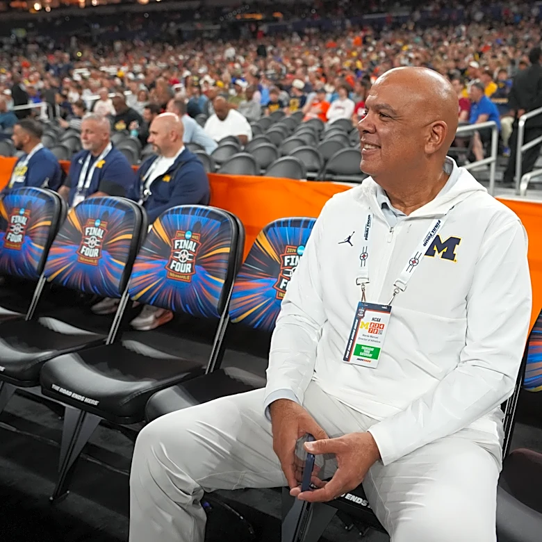 Michigan rolls in hoops and hockey but a football scandal leaves the athletic director on thin ice