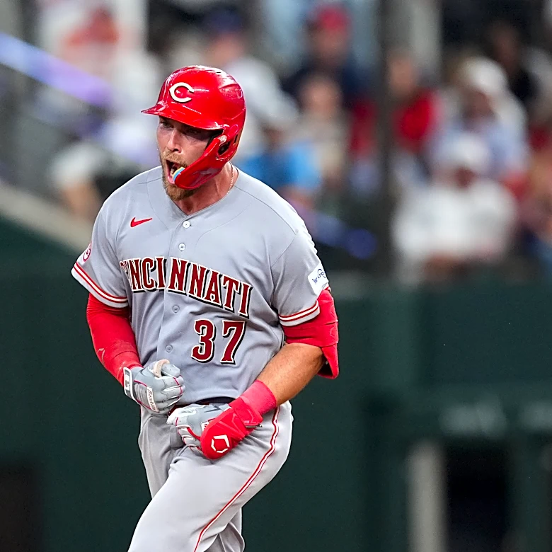 Reds beat Rangers 5-3 in their 1st road game with 3 homers, the last in the 9th
