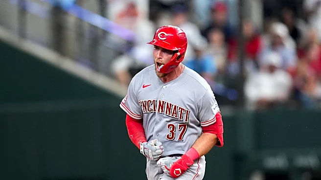 Reds beat Rangers 5-3 in their 1st road game with 3 homers, the last in the 9th