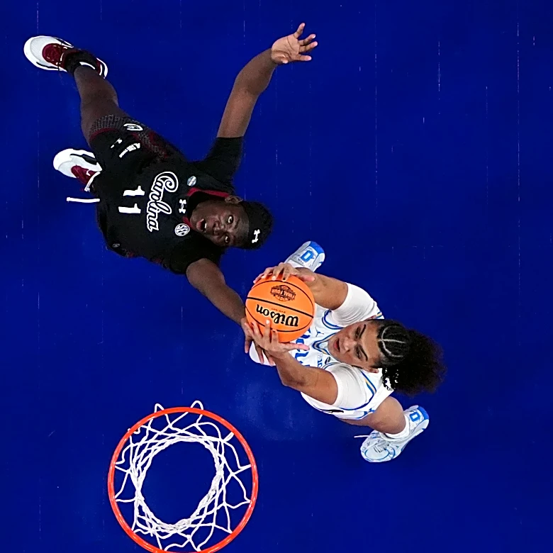 Staley embraces UCLA's Close ahead of title game, then smirks to the crowd after handshake drama