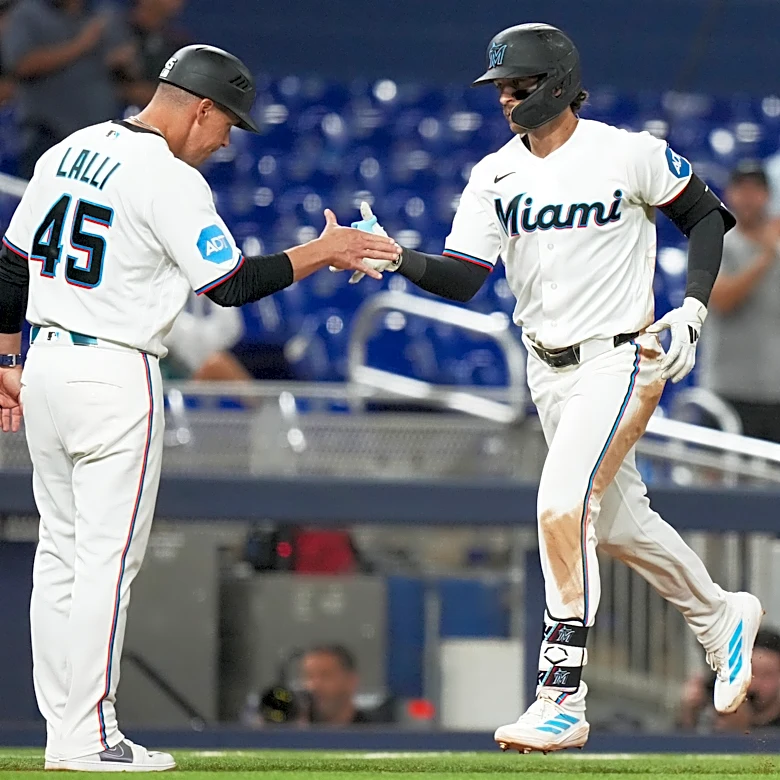 Conine and Norby homer to lead the Marlins to a 7-4 win over the Reds