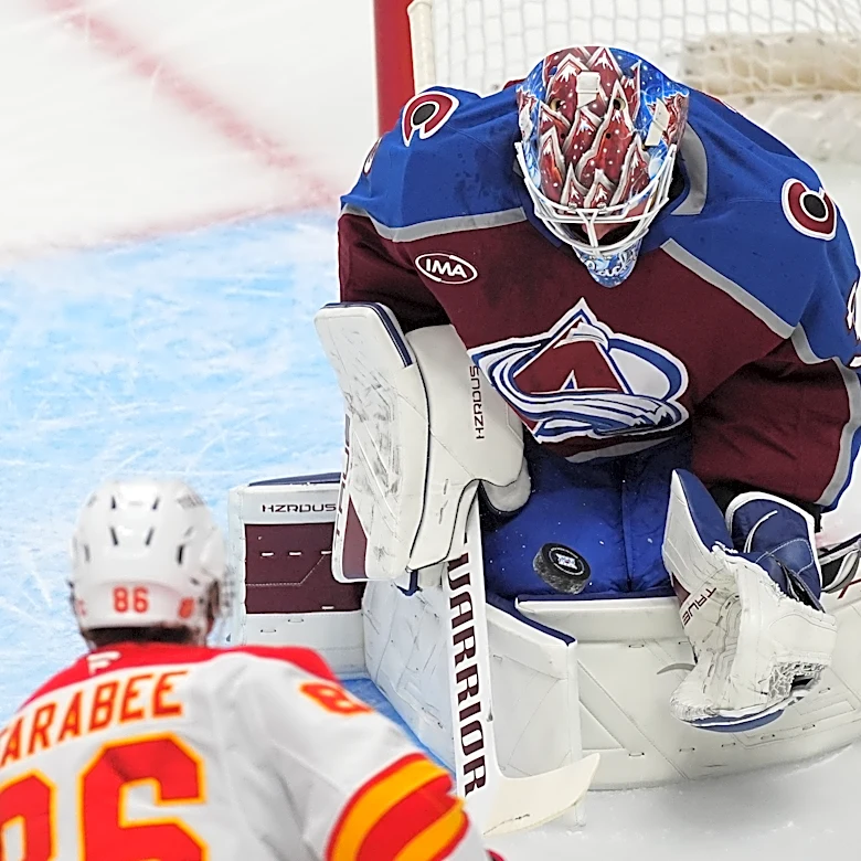 MacKinnon scores career-high 52nd goal of season, Avs clinch NHL's top seed with 3-1 win over Flames