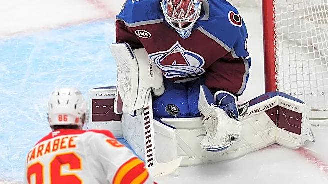 MacKinnon scores career-high 52nd goal of season, Avs clinch NHL's top seed with 3-1 win over Flames