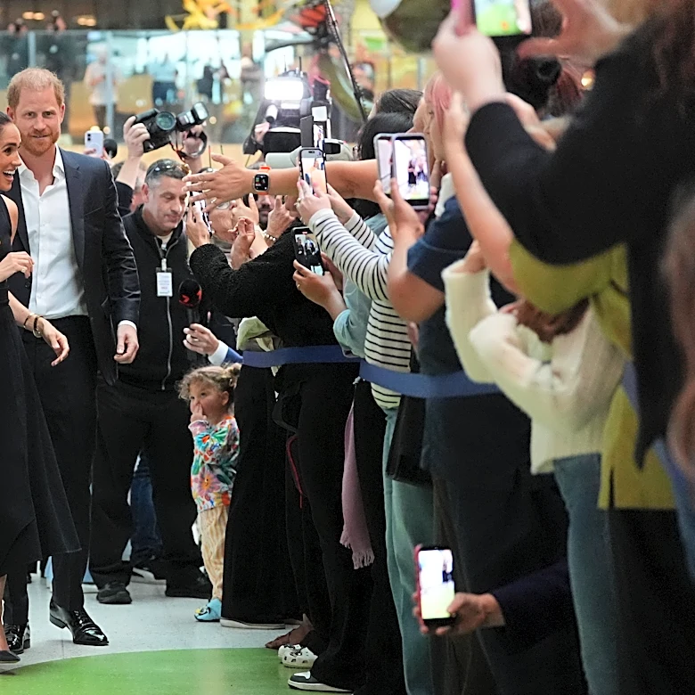 Prince Harry and Meghan arrive in Australia for a low-key, privately funded visit