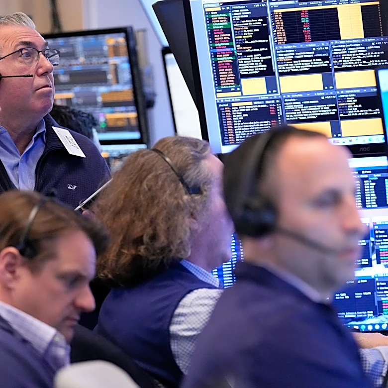 Stocks hover around their records as Wall Street waits for clues about where the Iran war is headed