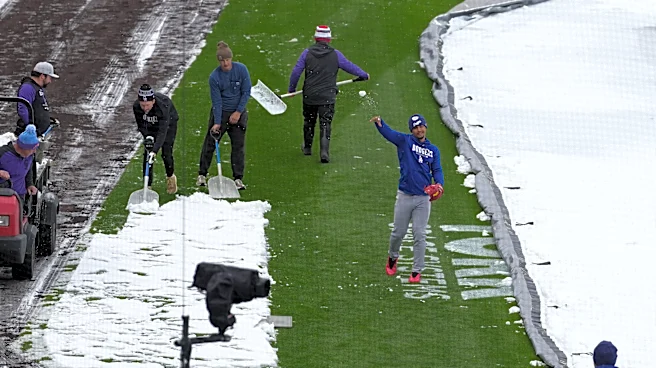 A mid-April snowstorm coats Coors Field as Dodgers-Rockies series gets off to frosty start