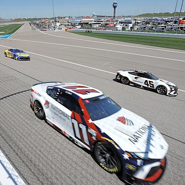 Tyler Reddick passes Kyle Larson on the final lap of OT to win NASCAR Cup Series race at Kansas