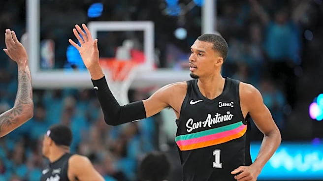 Wembanyama scores 35 points in playoff debut as Spurs roll past Trail Blazers 111-98