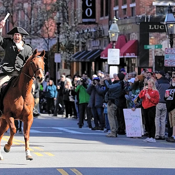 Paul Revere’s midnight ride unfolds in broad daylight — with a police escort