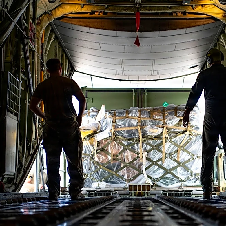 Searchers find the body of 1 of 6 missing crew from a ship that overturned during a typhoon