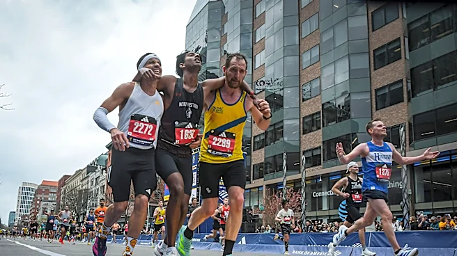 Runners were struggling to finish Boston Marathon when competitors came along and helped them across