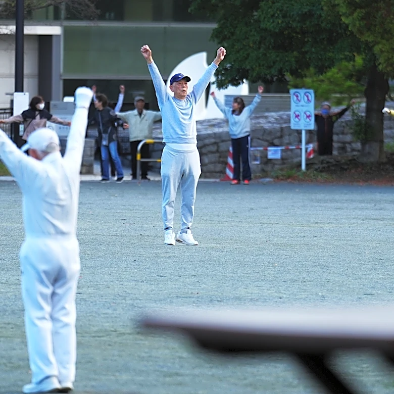 Japan awakens to Radio Taiso exercise tradition. One face of the country's longevity