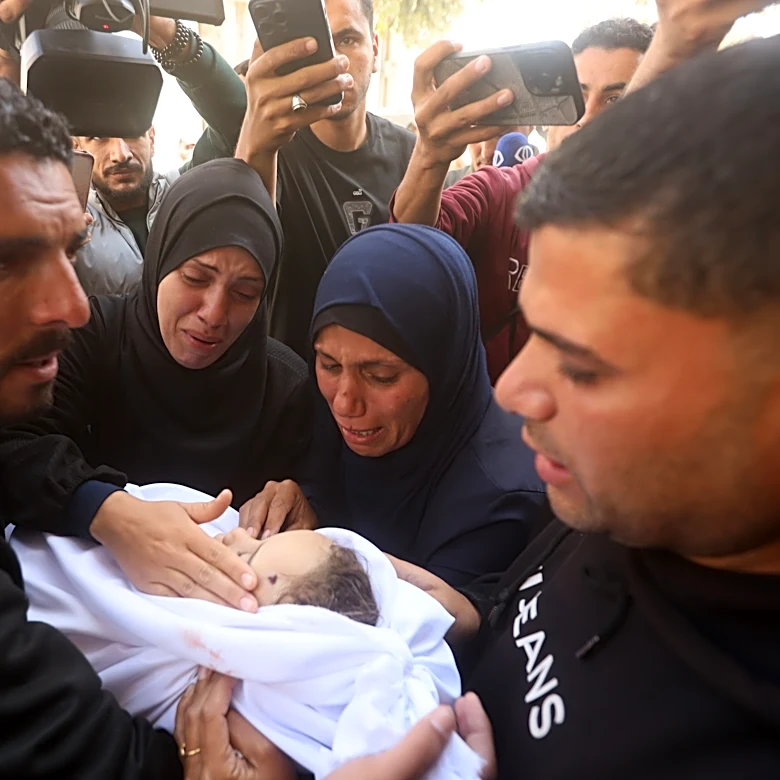 Palestinians hold funerals for pregnant woman and her children killed in Israeli strikes