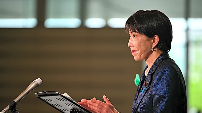 Japan's prime minister launches a panel to review her country's defense policies as threats escalate