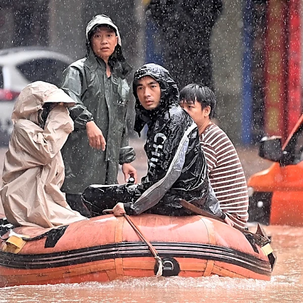Heavy flooding in southern China forces evacuations and leaves vehicles submerged