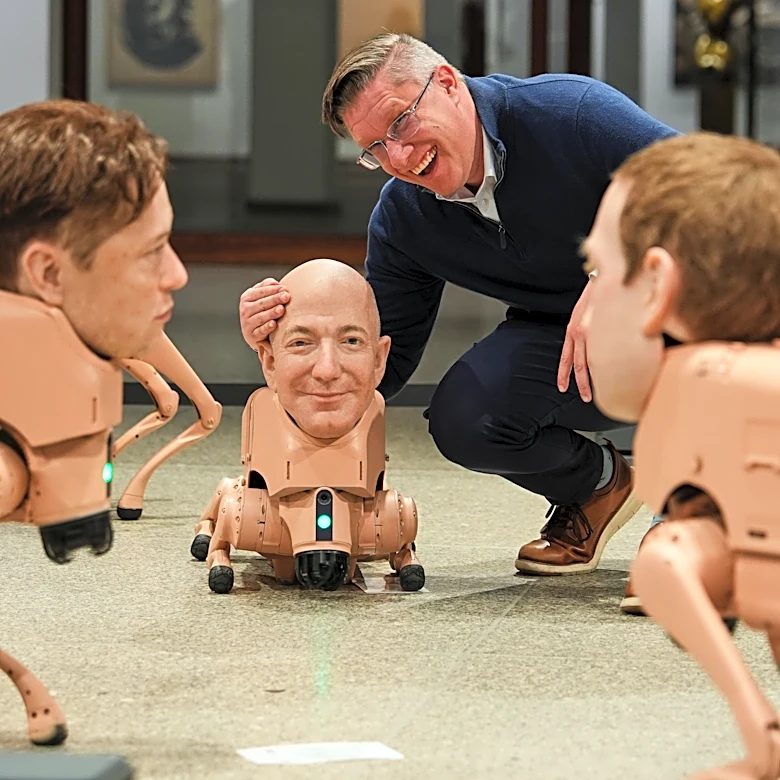 Robot dogs with Musk and Zuckerberg heads roam around Berlin museum in Beeple's new exhibit