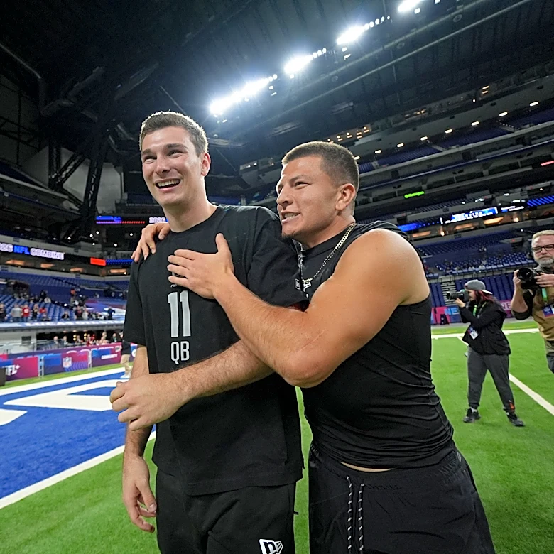Heisman runner-up Pavia agrees to sign with the Ravens as an undrafted free agent, an AP source says