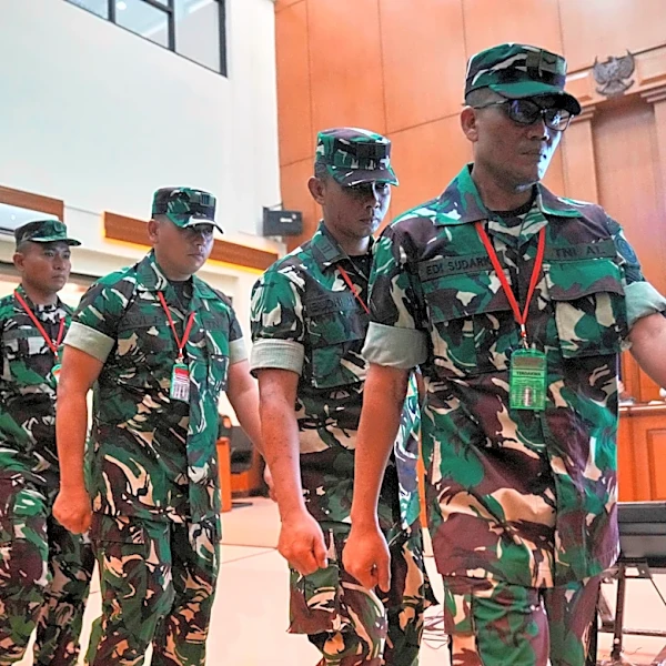 Trial begins for 4 Indonesian service members charged over acid attack on activist