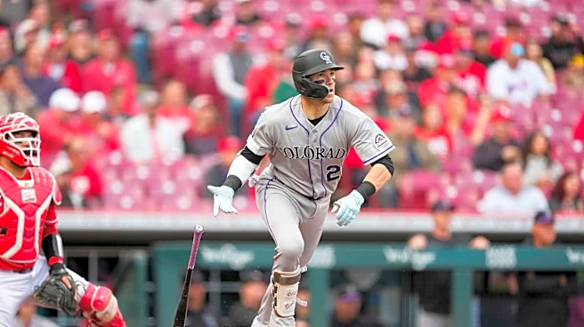 Goodman hits 2 HRs, Sugano pitches 5 1/3 scoreless innings, Rockies beat Reds 13-2