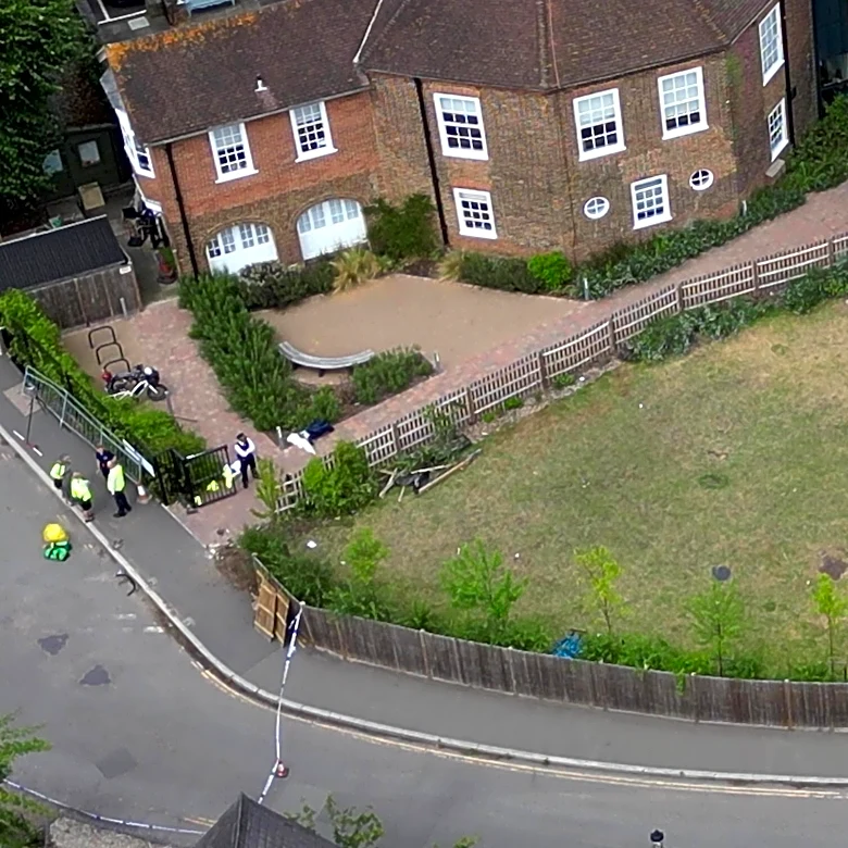 Woman who drove into a tea party outside a London school charged over death of 2 girls