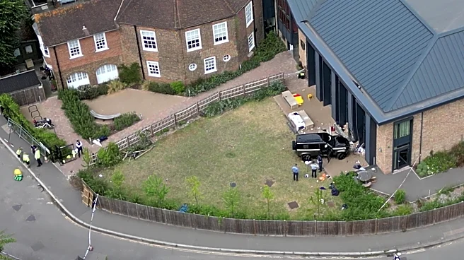 Woman who drove into a tea party outside a London school charged over death of 2 girls