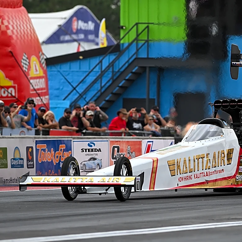 Shawn Langdon breaks the NHRA speed record by reaching 345 mph in his Top Fuel dragster