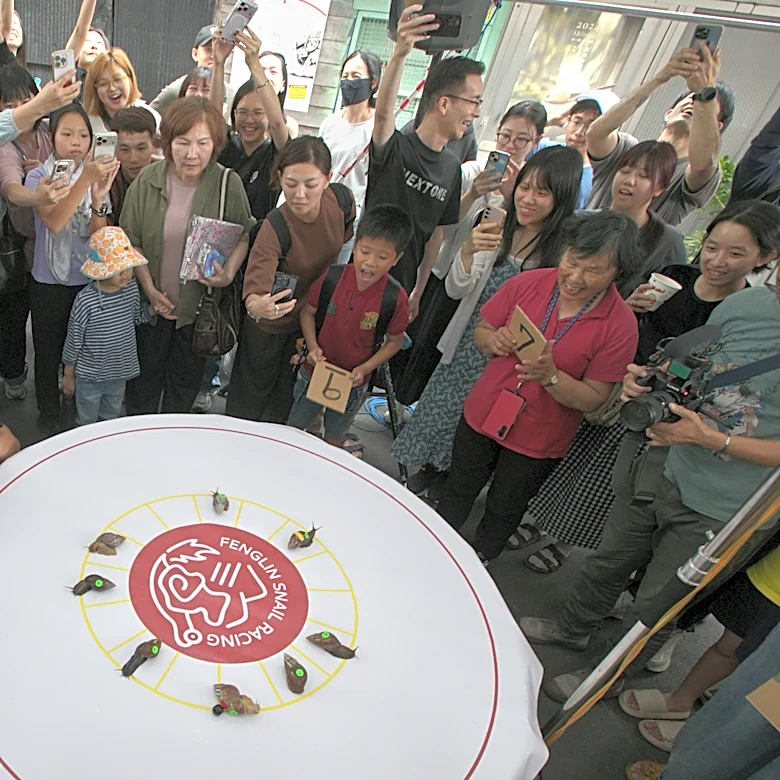 A Taiwanese town embraces a slow pace of life through a snail race