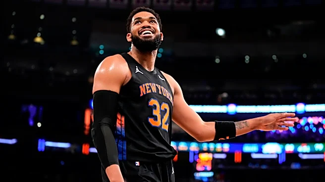 Glass cleaner: Karl-Anthony Towns dislodges ball behind backboard after Andre Drummond can't