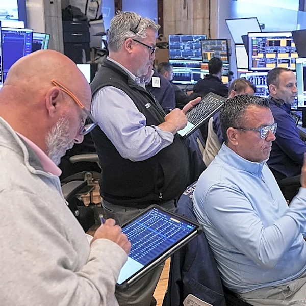 US stocks hover just below records as oil slips on hopes of an Iran deal