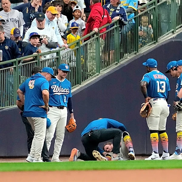 Brewers outfielder Brandon Lockridge carted off field after crashing into wall chasing foul ball
