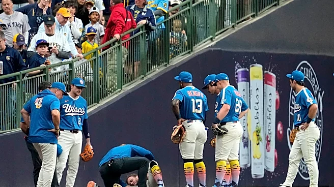 Brewers outfielder Brandon Lockridge carted off field after crashing into wall chasing foul ball