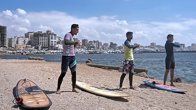 Surfers in war-torn Gaza find rare moments of joy taking to the waves