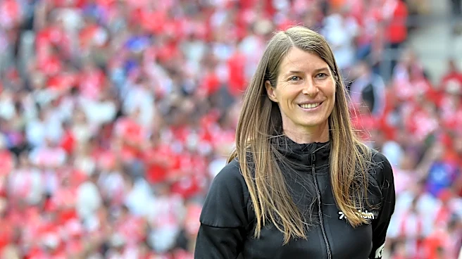 Marie-Louise Eta becomes first female head coach to win a Bundesliga game