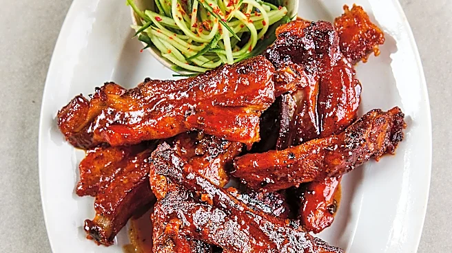 Slow-cooked, sticky-glazed pork ribs go with cucumber slaw in Sam Way's recipe