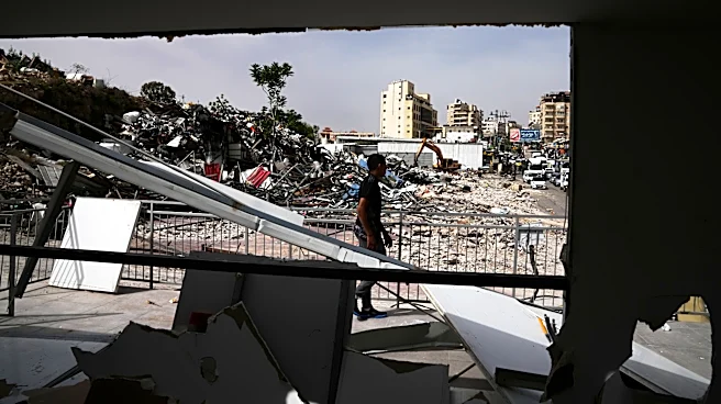 Israeli bulldozers raze about 50 Palestinian shops ahead of settlement-linked road project