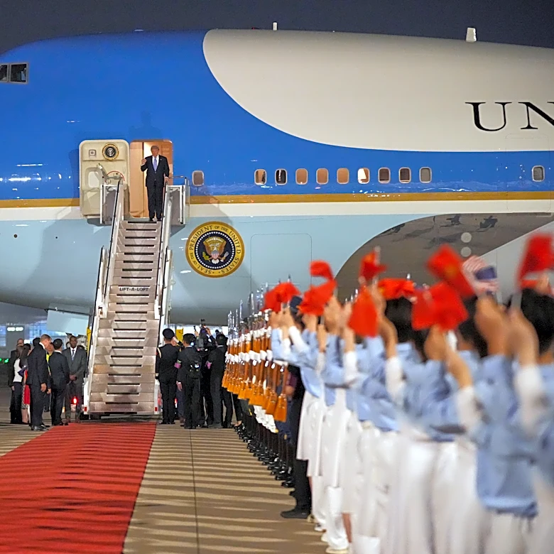 The Latest: Trump arrives in China to meet with Xi in Beijing