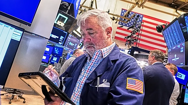 Tech carries Wall Street to records, even as most stocks fall after discouraging inflation data