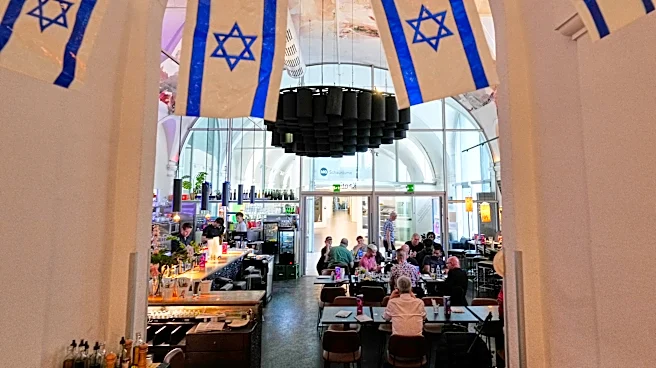 A Vienna cafe offers a welcome for Israel supporters as tensions brew at the Eurovision Song Contest