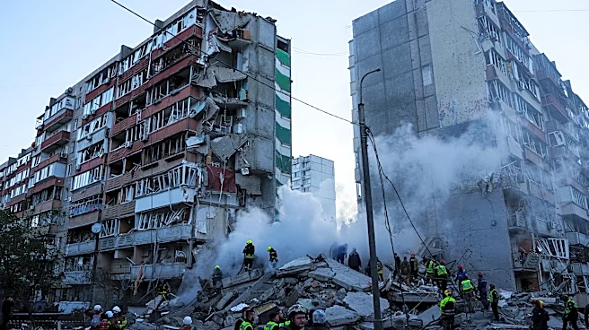 Russia hammers Ukraine for a 3rd straight day, flattening a Kyiv apartment block and killing 9