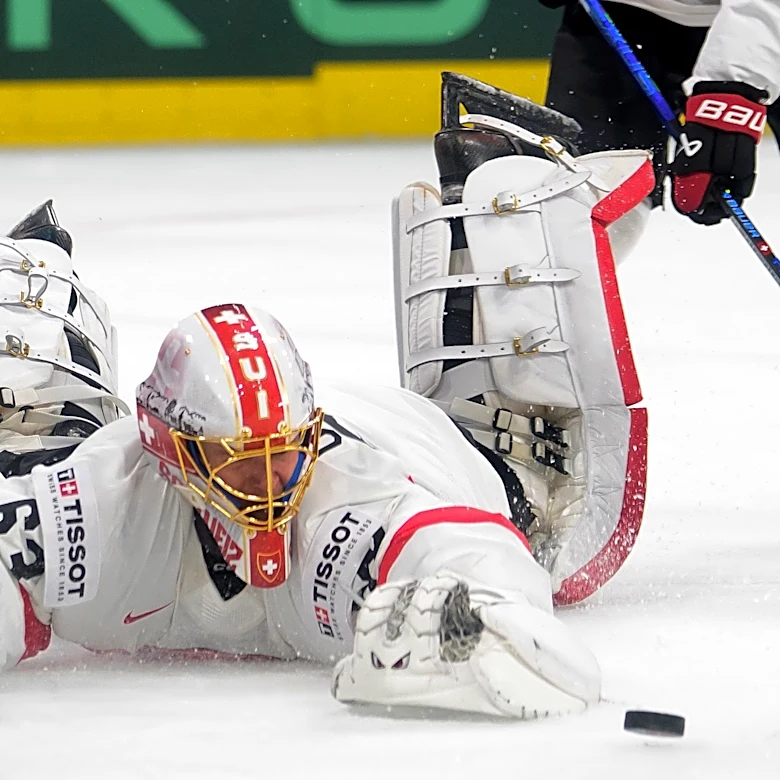Switzerland beats defending champion the US in ice hockey worlds opener