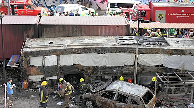 A cargo train hits a public bus at a Bangkok rail crossing, killing at least 8