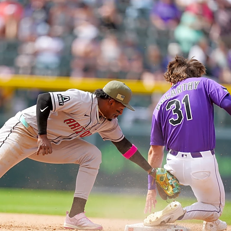 McCarthy singles twice and has an RBI against former team, helping Rockies beat Diamondbacks 4-2