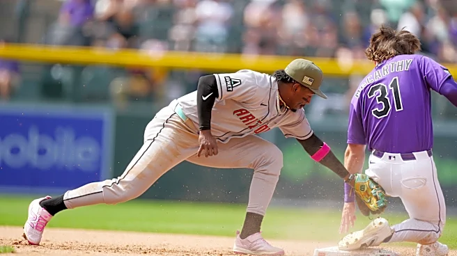 McCarthy singles twice and has an RBI against former team, helping Rockies beat Diamondbacks 4-2