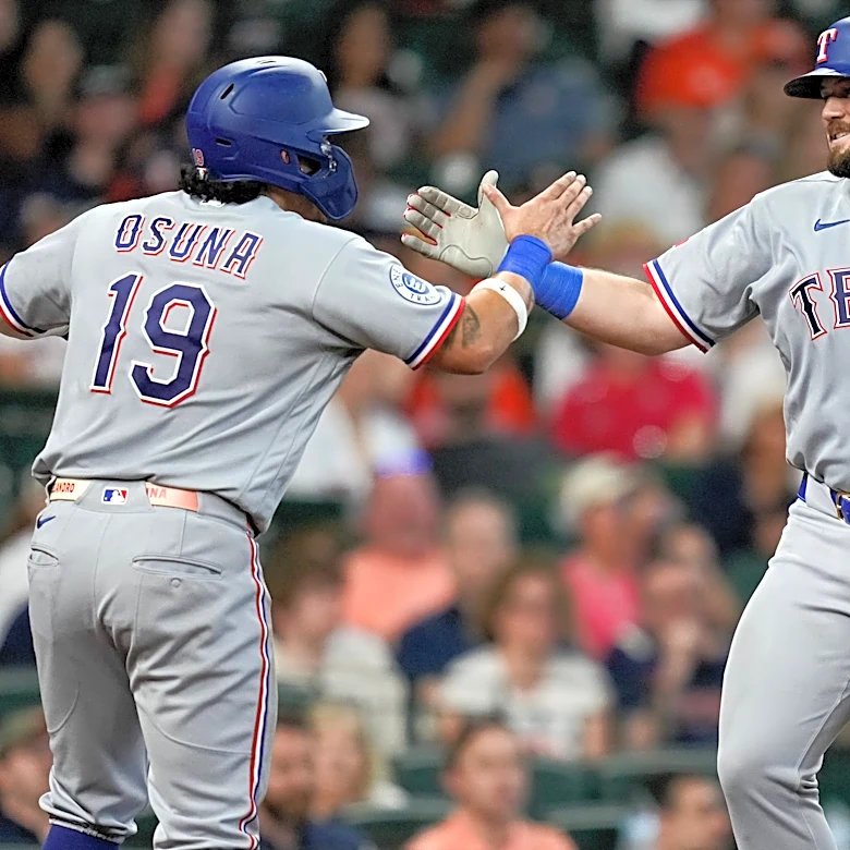 Burger blasts a homer, drives in 4 as Eovaldi powers the Rangers past the Astros 8-0