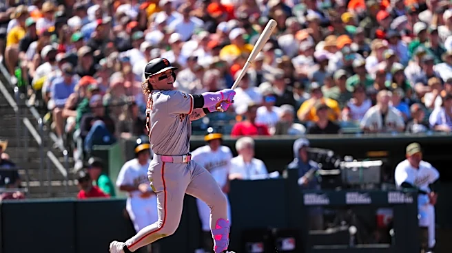 Bader's wind-aided grand slam helps Giants breeze to 10-1 victory over Athletics