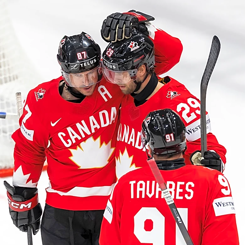Canada beats Denmark and Crosby tallies 4 assists in third-period surge at hockey worlds