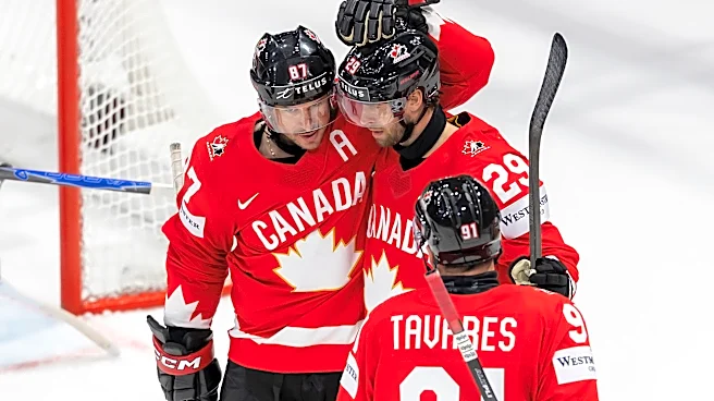 Canada beats Denmark and Crosby tallies 4 assists in third-period surge at hockey worlds