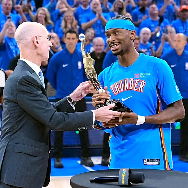 Shai Gilgeous-Alexander gets the MVP trophy from NBA Commissioner Adam Silver